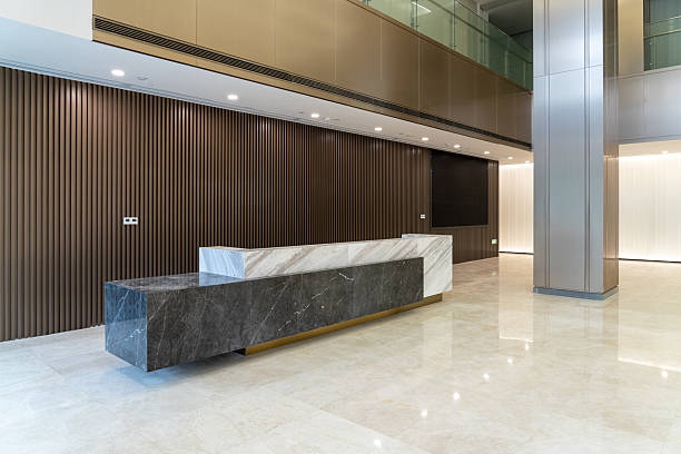 Hotel reception after its dark wood and marble surface transformation